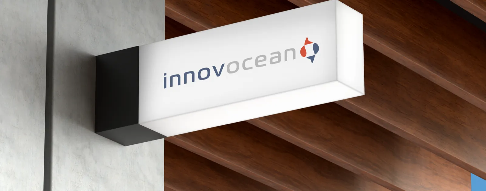 An illuminated Innovocean sign mounted on a building exterior.